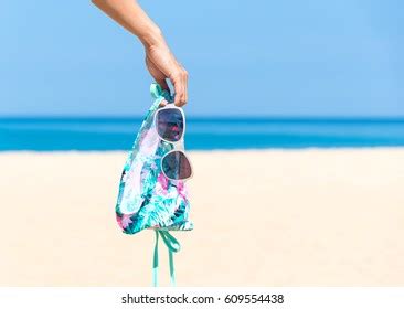 Woman Hand Holding Bikini On Beautiful Stock Photo Shutterstock