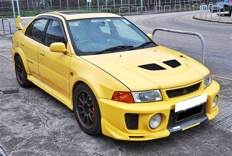 Yellow Mitsubishi Lancer Evolution V Scrolller