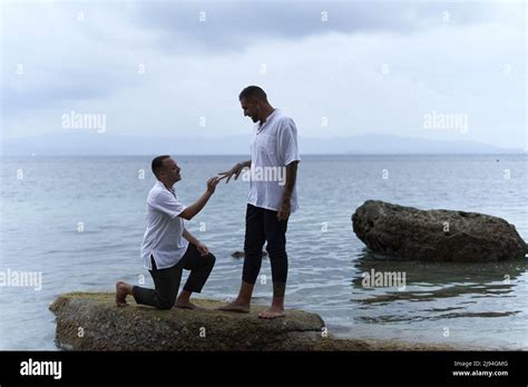 Gay Man On His Knees Asking His Partner To Marry Him Next To The Sea Stock Photo Alamy