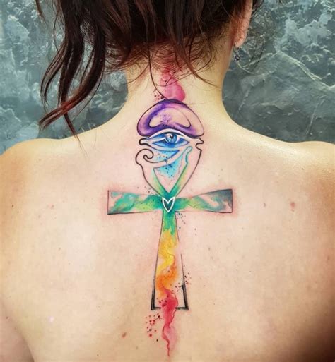 Watercolor Style Ankh Tattoo Located On The Upper Back