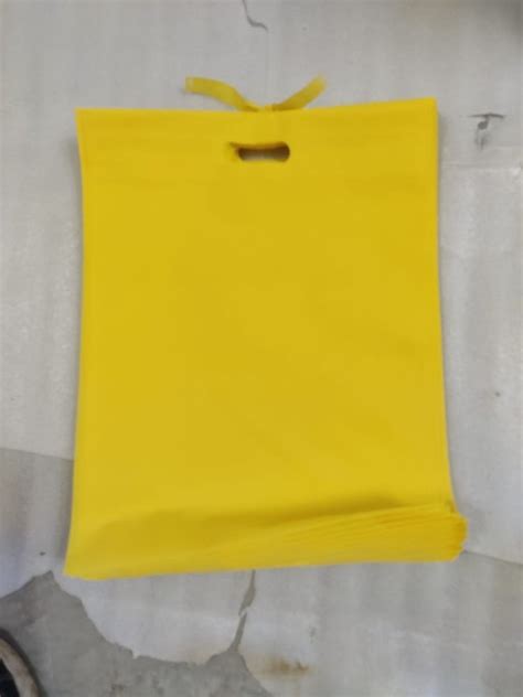 Plain Yellow Non Woven D Cut Bag For Shopping At Rs 121 Kg In