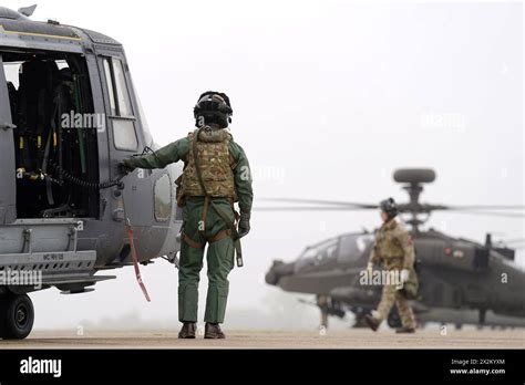 A Wildcat Reconnaissance Helicopter Left And A British Army Apache Ah