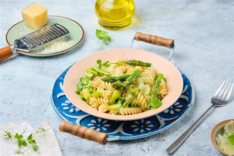 Pasta Primavera Fusilli With Green Peas Asparagus And Parmesan Cheese