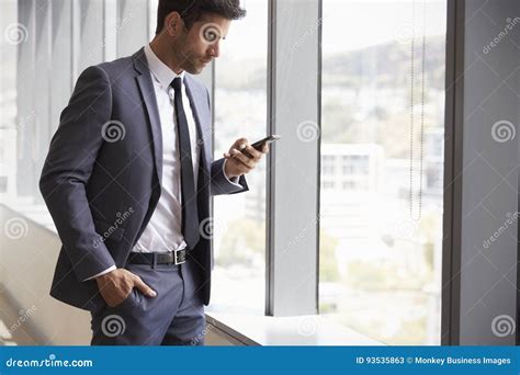 Businessman Checking Messages On Mobile Phone Stock Image Image Of