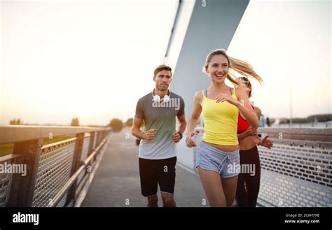 Early Morning Workout Happy People Running Across The Bridge Living