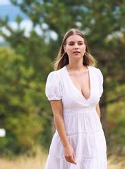 Yana Love Smiles Sweetly As Her Dress Slips From Her Shoulder To Expose Her Big Natural Tits