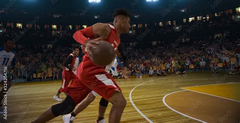 Basketball players on big professional arena during the game. Tense ...