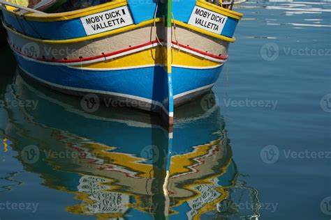 Malta Colorful Painted Fishing Boat In Marsaxlokk Village