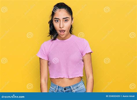 Hispanic Teenager Girl With Dental Braces Wearing Casual Clothes In