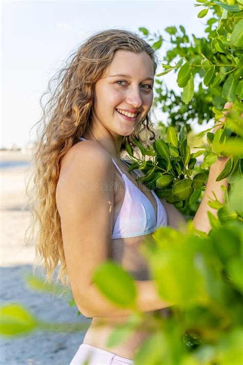 Lovely Blonde Bikini Model Posing Outdoors On A Caribbean Beach Stock