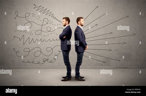 young conflicted businessman choosing   directions