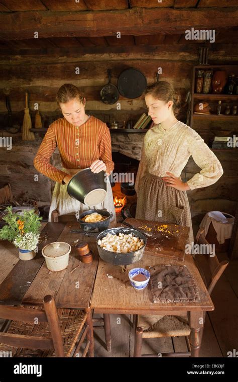 Pioneer cooking in dutch ovens Stock Photo - Alamy