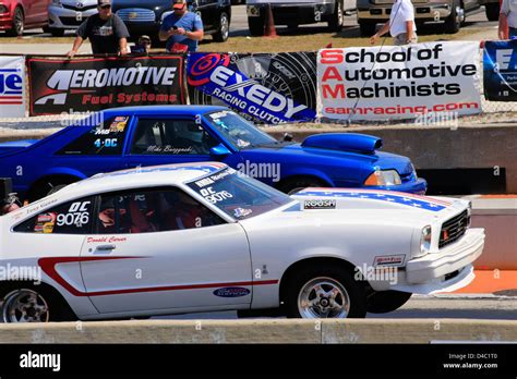 Two drag race cars racing on a drag strip at the Bradenton Raceway in ...