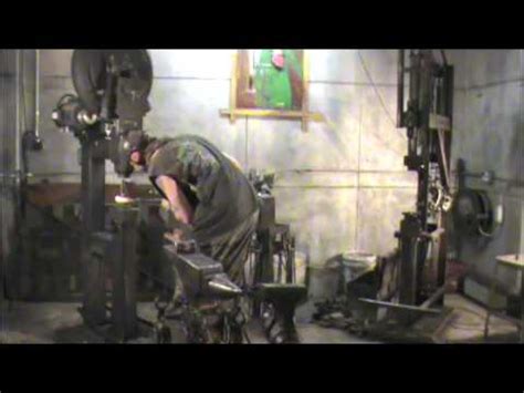 Artist Blacksmith Matt Waldrop making iron handles on Clay Spencer tire ...