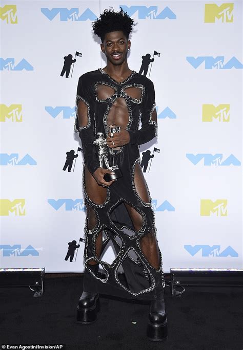 Exclusive Lil Nas X Gets Fashionably Dramatic While Baring Chiseled Chest In Startling