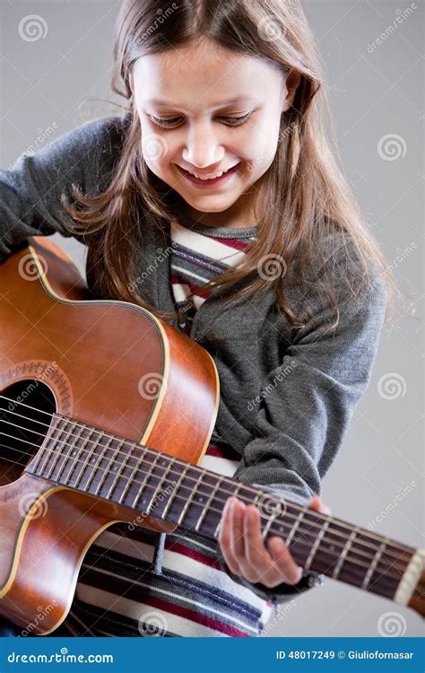 Little Girl Playing Acoustic Guitar Stock Image Image Of Committment