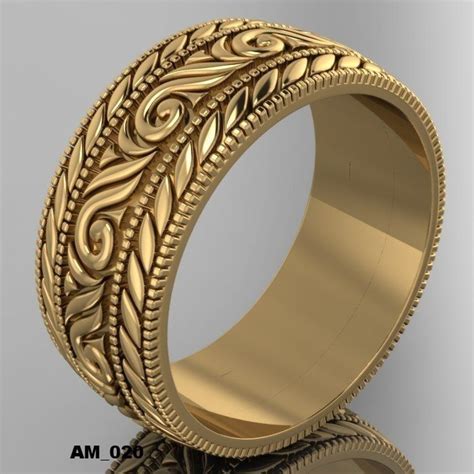 A Gold Wedding Ring With Intricate Designs On The Outside And Inside