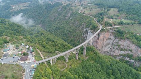 Tilting Drone Shot Of Long Durdevica Bridge Across Tara River In