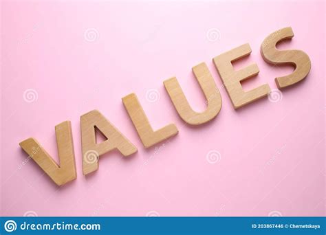 Word Values Made Of Wooden Letters On Pink Background Flat Lay Stock