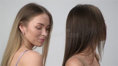 Two Young Multiracial Women Asian And A Caucasian Girls Pose Together