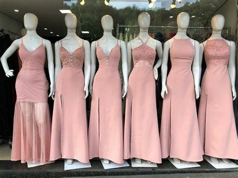 Mannequins Dressed In Pink Dresses On Display At A Clothing Store Front