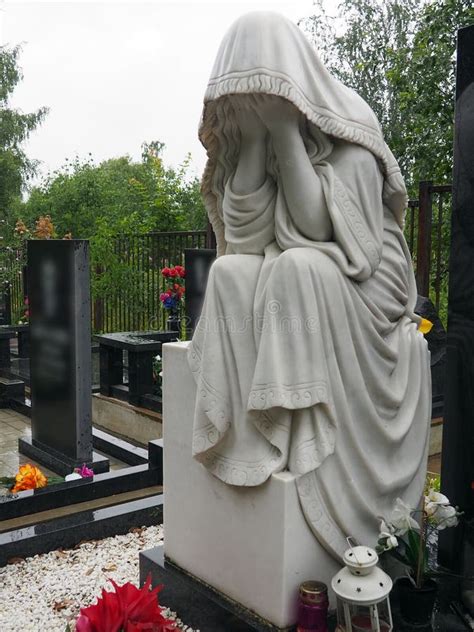 Weeping Woman Sculpture In The Cemetery The Figure Of A Mother Wife Or Woman In A Hood Or