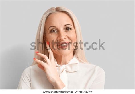 Mature Blonde Woman On Light Background Stock Photo Shutterstock