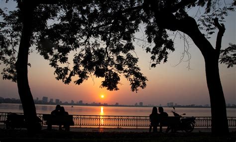 sunset  ho tay west lake hanoi yt living nomads travel tips