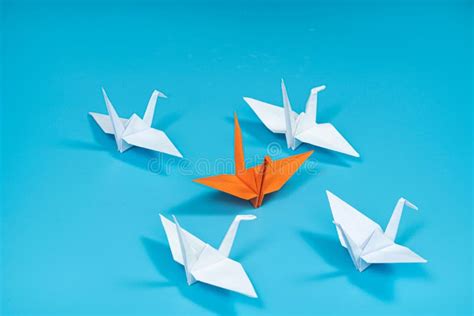 Concept Of Standing Out Portrayed In A Group Of Origami Cranes One Of