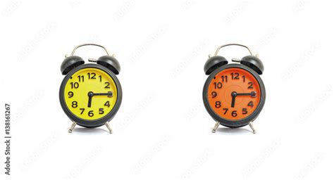 Closeup Yellow Alarm Clock And Orange Alarm Clock For Decorate Show A