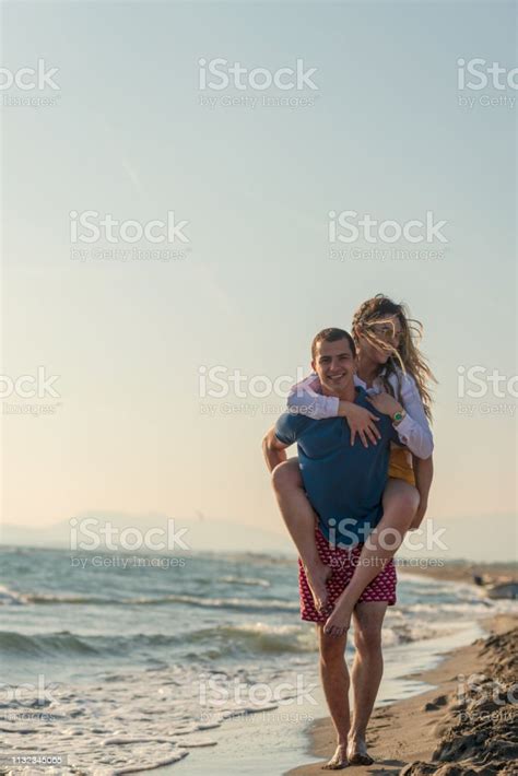 Happy Romantic Middle Aged Couple Enjoying Beautiful Sunset Walk On The