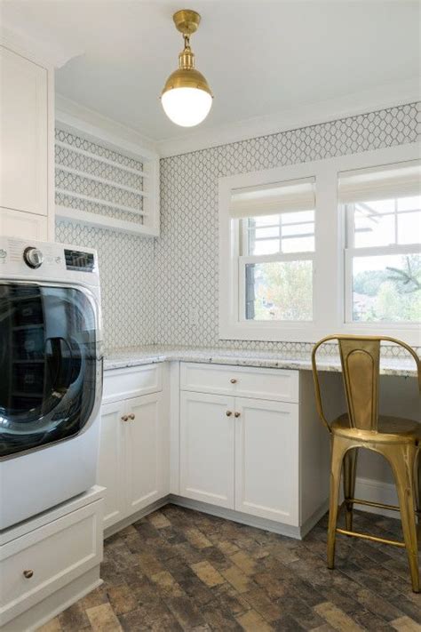 A Washer And Dryer In A White Kitchen