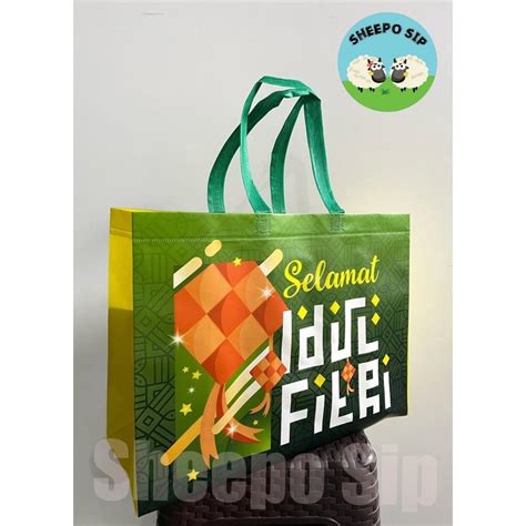 Jual TAS SPUNBOND LAMINASI FULL COLOR TAS PARCEL LEBARAN PREMIUM