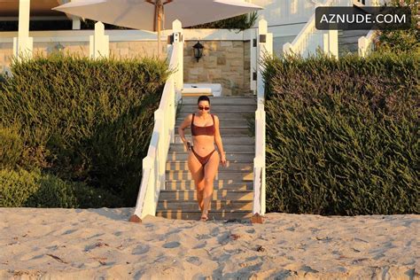 Kim Kardashian Rises Up Early For A Morning Sunrise Stroll In A Maroon Bikini Showcasing Her