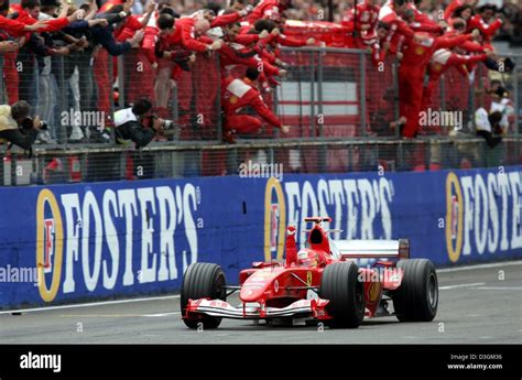 (dpa) - The Ferrari team cheer as German formula one pilot Michael ...