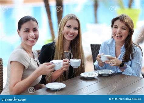 Young Women Drinking Coffee In A Cafe Outdoors Stock Photo Image Of