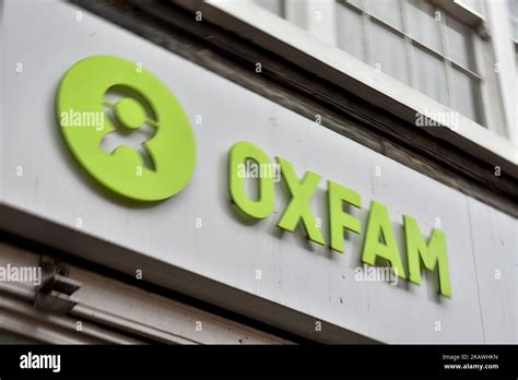 An Oxfam Sign Is Pictured Outside A Charity Bookshop In Central London