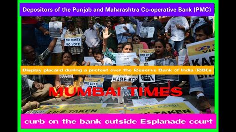 Pmc Depositors Display Placard During A Protest Over The Rbi Curb On