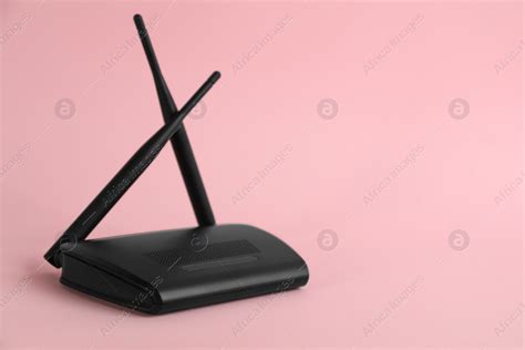 Modern Wi Fi Router On Light Pink Background Space For Text Stock