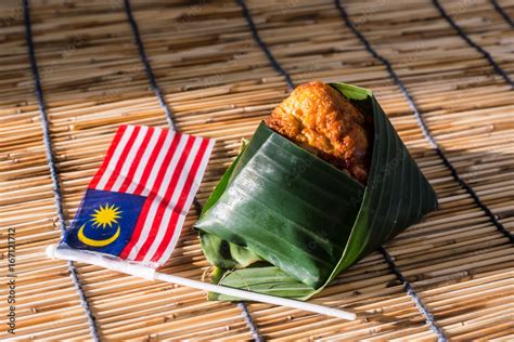 Nasi Lemak Wrapped In Banan Leaf Malaysian Food And Malaysia Flag The