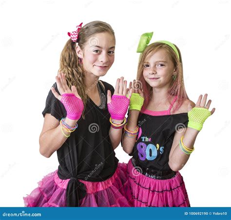 Young Girls Dressed In Retro 80s Clothing Isolated On A White