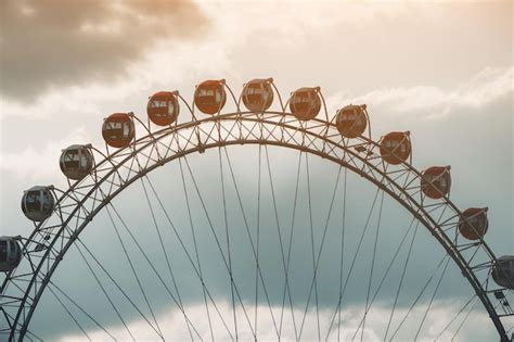 Premium Photo Ferris Wheel In Amusement Park Against Sky Background