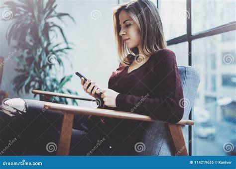 Blonde Yound Woman Holding Modern Mobile Phone In Hands Girl Pointing Fingers On Empty Touch