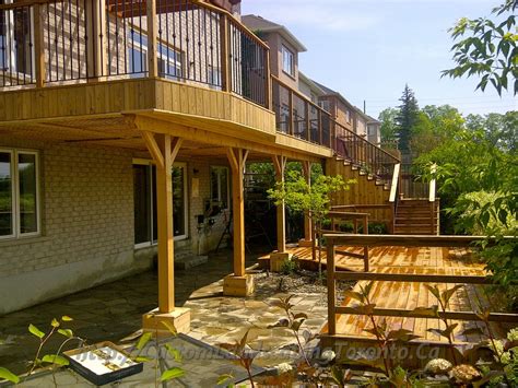 Basement Walkout Interlock With Deck And Pergola Toronto Landscaping Design And Interlock