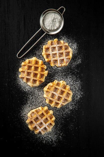 Premium Photo Belgian Waffles Sprinkled With Sugar On Black Table Top