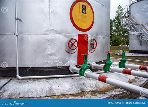 Large Oil Tank with Valves and Pipings Stock Photo - Image of lines ...