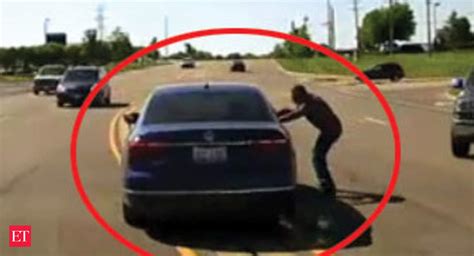 Watch Man Jumps Into Moving Car Saves Seizure Victim The Economic