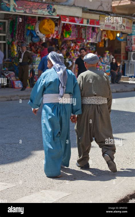 Elderly Muslim Kurdish Iraqi men holding hands in Dohuk, Kurdistan ...