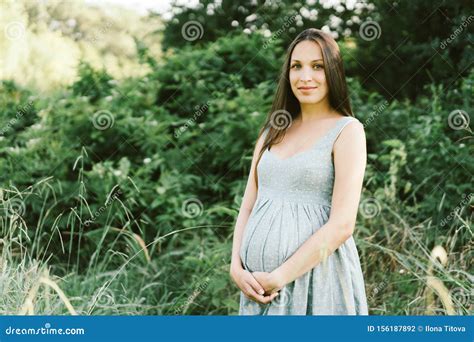 Pregnant Brunette Woman In The Park Stock Photo Image Of Abdomen Copyspace 156187892