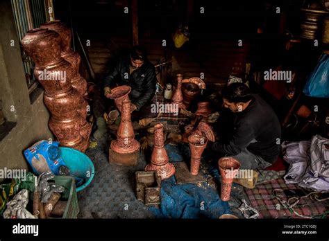 Kashmiri Coppersmiths Work On Copper Utensils At A Workshop Copper